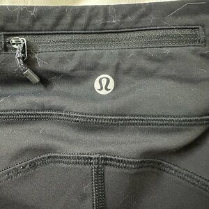 Lululemon black leggings designed for a flattering, sculpting fit size 4
